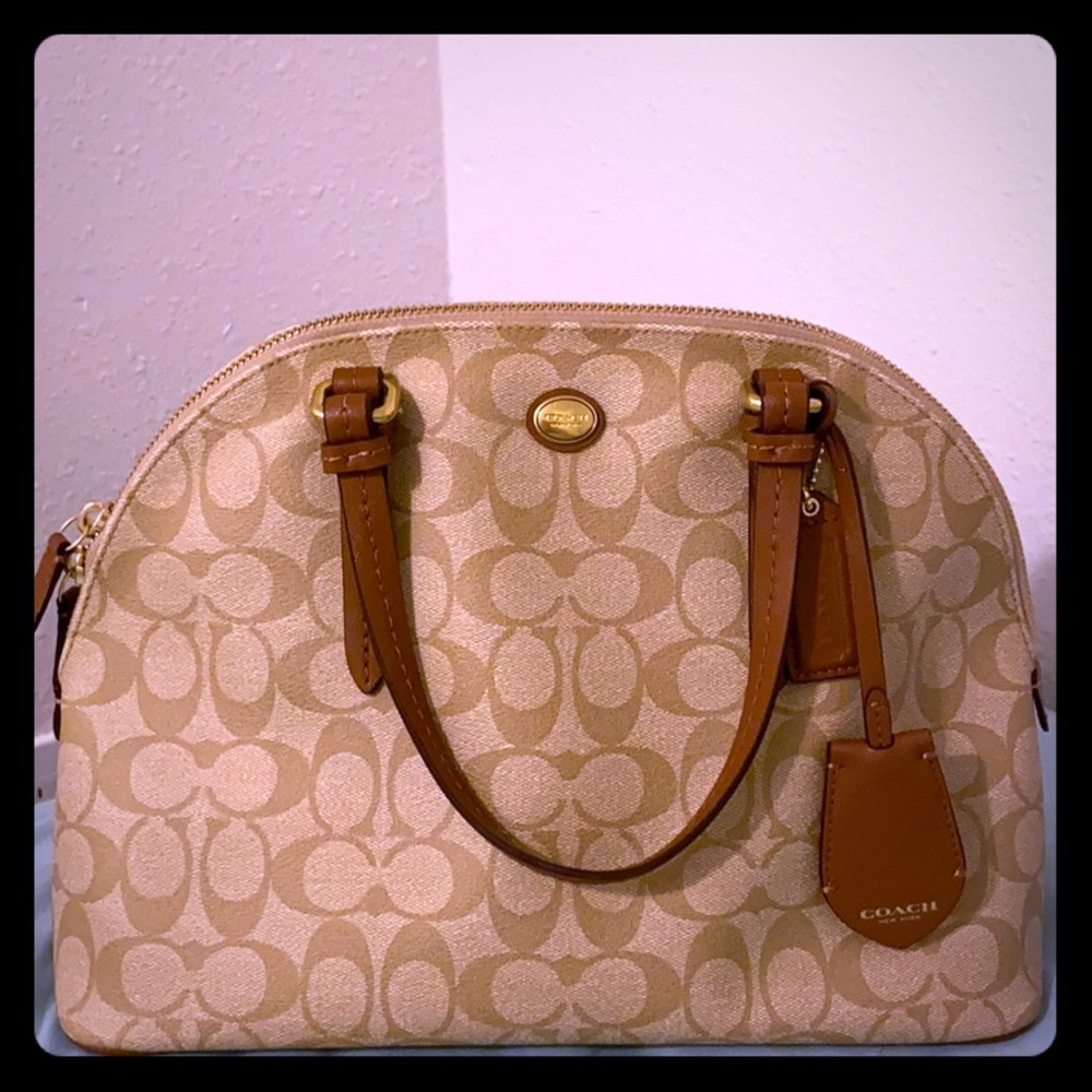 Coach leather shell bag with signature canvas.